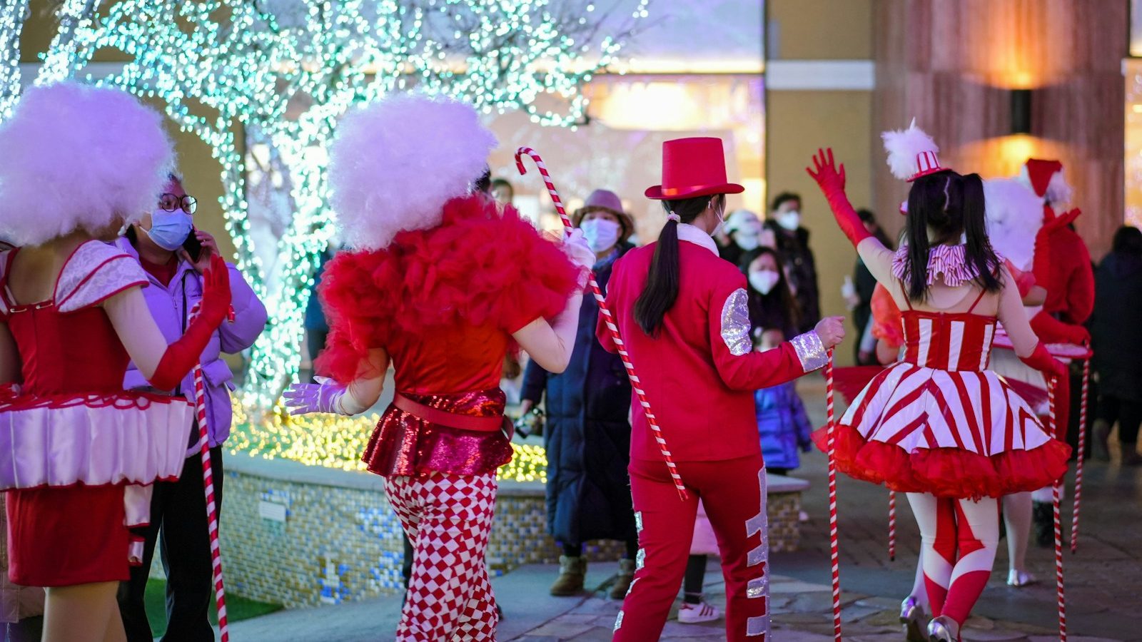 a group of people dressed in red and white costumes